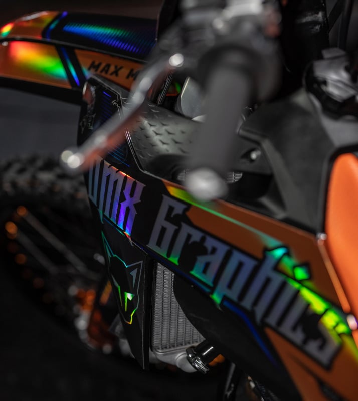 Close up photo of dirt bike equipped with custom graphics