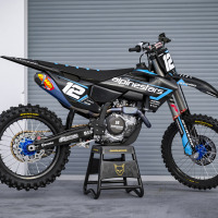 Black Husqvarna Mx Graphics Kit Payback Installed on Husqvarna Dirt Bike Promo Image