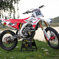 White Suzuki Mx Graphics Kit Installed on Suzuki Dirt Bike Payback Promo