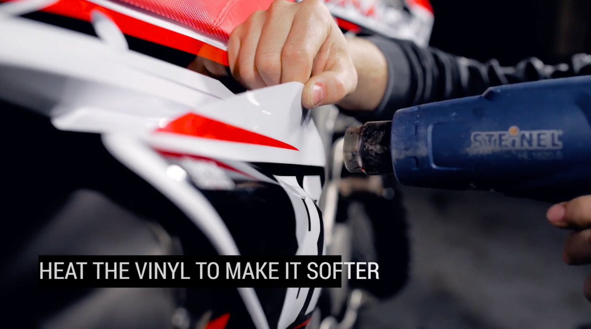 Using heat gun on difficult parts while installing mx graphics kit