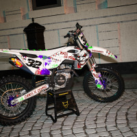White Husqvarna Mx Graphics Kit Joker Installed on a Husqvarna Dirt Bike Promo