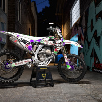 White Triumph Mx Graphics Kit Joker Installed on a Triumph Dirt Bike Promo